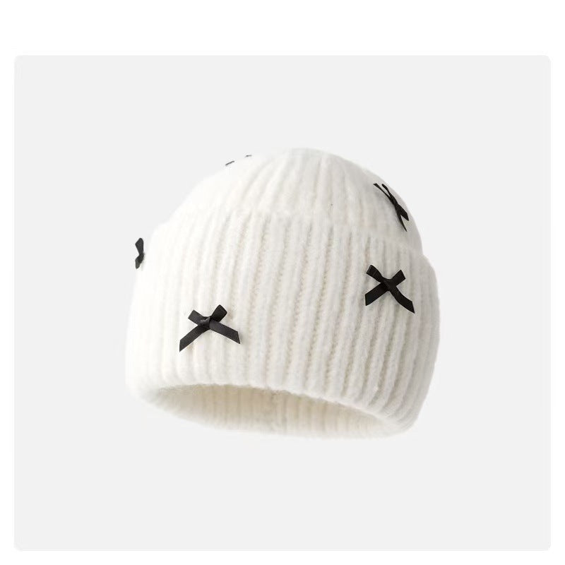 Wholesale Sweet woolen hat with bow for autumn and winter